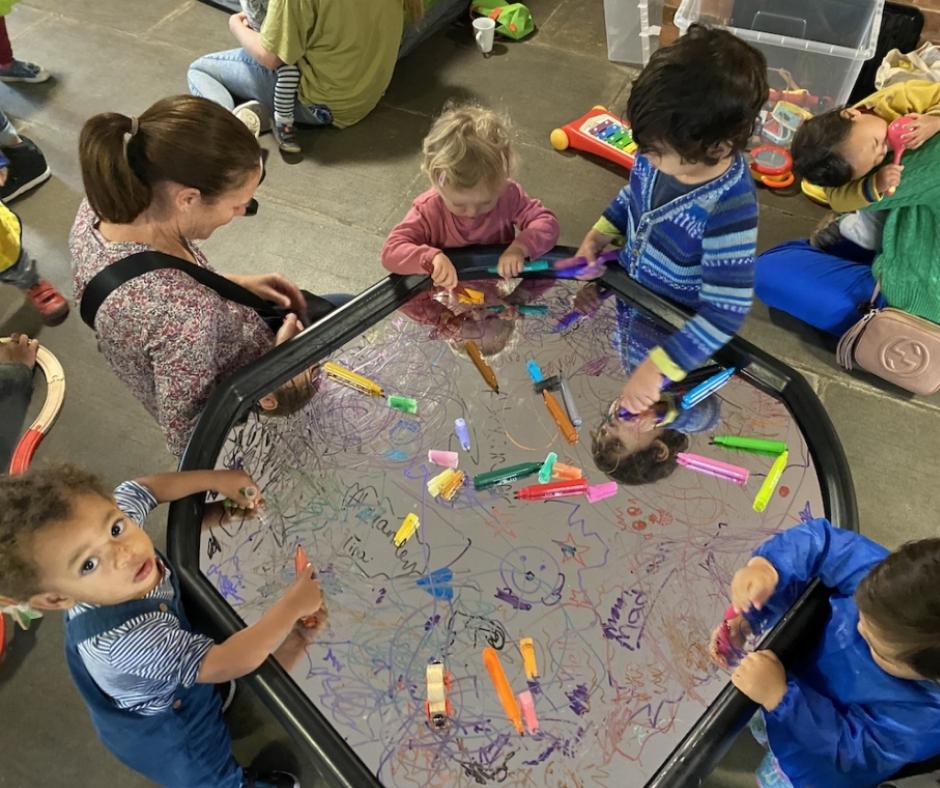 A group of small children drawing